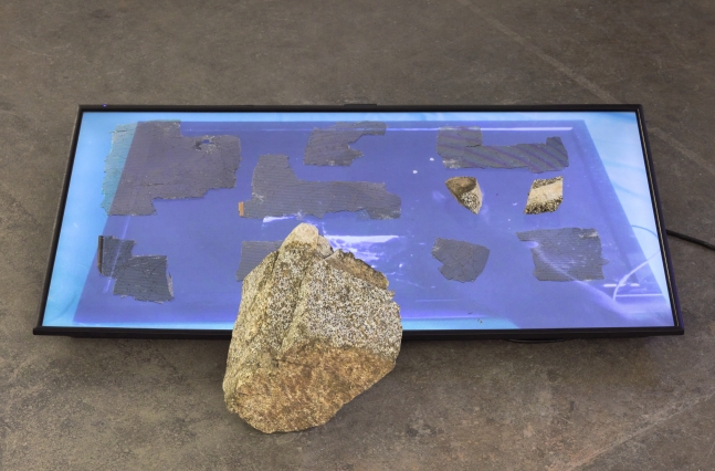 Jennifer West
Smash the Screen Media Archaeology/Rock, 2020
2K video (transferred&amp;nbsp;from 16mm print), rock, flatscreen television shards (broken flatscreen televisions collected from street curbs in Los Angeles and smashed)
10 x 38 x 30 in
25.4&amp;nbsp;x 96.5&amp;nbsp;x 76.2&amp;nbsp;cm