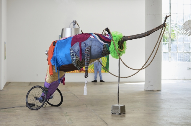 Simphiwe Ndzube
Beast of No Nation, 2021
fabric, fog machine, resin, wood, metal, rope, motorbike lights, found clothing and tires
dimensions variable